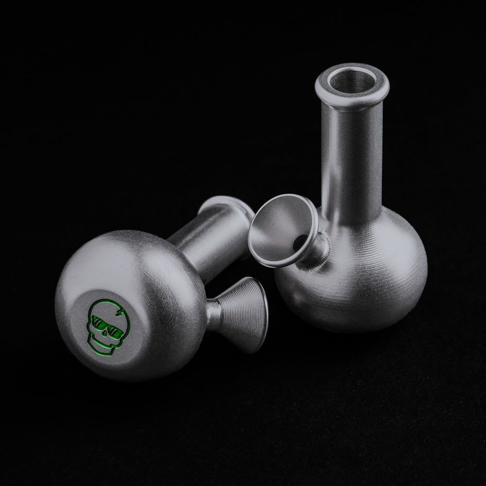 Silver Bong Ball Marker with green skull on bottom.