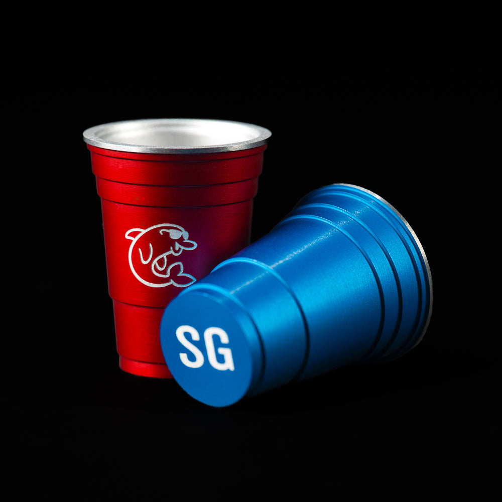 SWAG Golf red or blue flip cup aluminum golf ball marker accessory.